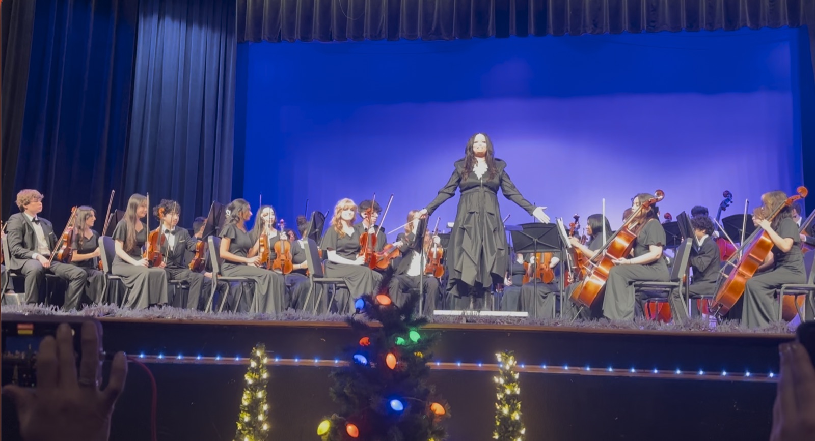 Full Philharmonic Orchestra with conductor at Winter Concert